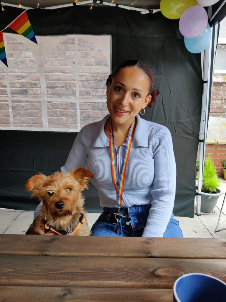 Colleague sitting with small dog