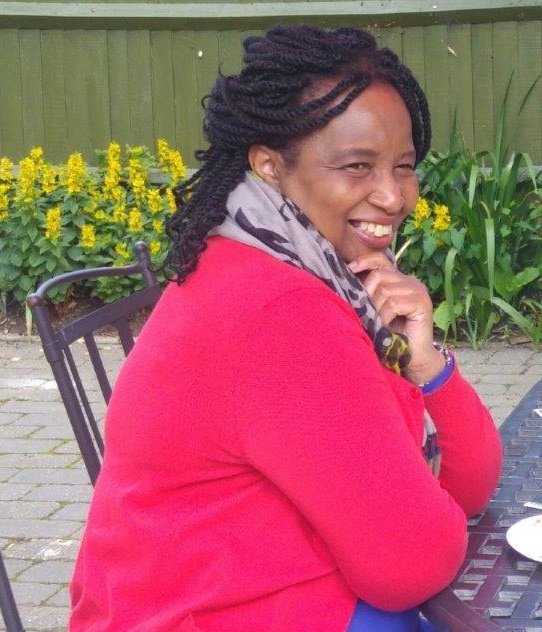 Doris Adeyinka smiling in garden