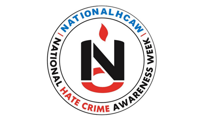 National Hate Crime Awareness Week logo featuring the campaign name encircling a bold emblem with a flame symbol.