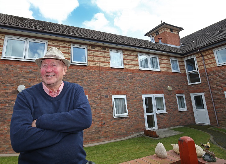 Man outside Higham Way House, Riverside's Retirement Living accommodation in Bosworth