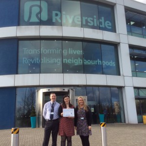 LIAISE Manager Cath Wolhers presents Riverside's award to Frank Burke and Jen Ross