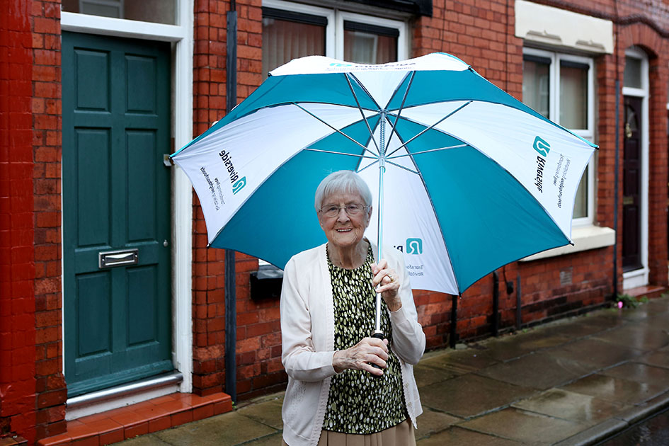 Florence Black standing outside her Riverside home