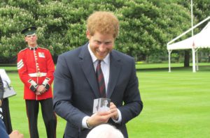 Prince Harry with veterans at Buckingham Palace.