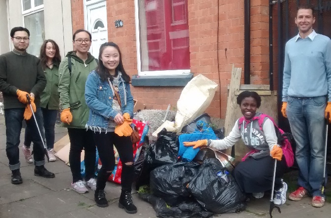 Riverside staff volunteers and students from De Montfort University clean up a neighbourhood in Leicester