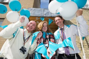 Riverside managers Russell Wilkinson, Laurel Struthers and Simon Allcock celebrate the opening of the refurbished Willow Walk homeless housing support in Cambridge