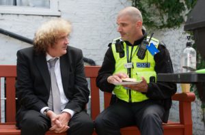 PCSO Anthony Marriott chats with former resident Patrick Quinn.