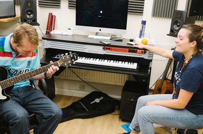 Resident at King George's Hostel in Westminster Michael Higgins in recording studio, Changes, with Riverside Support Worker Cleo Sava