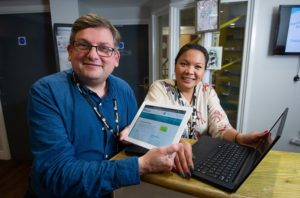 Riverside's Andy Cave and Caroline Yau at Cangle Foyer in Haverhill get online with the free Wifi provided by Riverside.