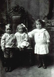 Nel (right) with two younger siblings (c.1916)