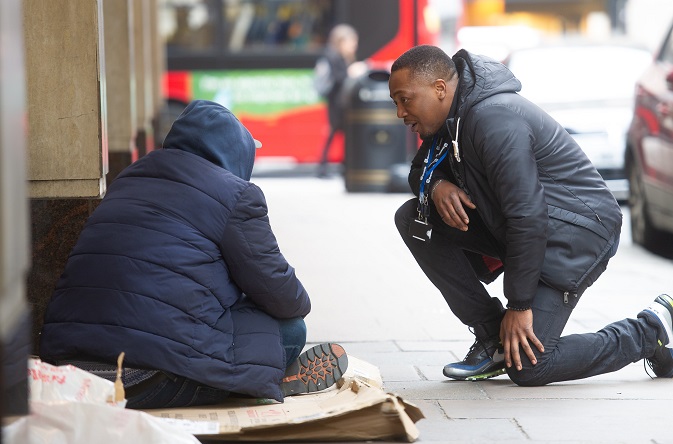 Riverside Street Buddy Ashley Maigwa chats to a homeless man on the streets of Westminster.