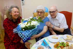 Jim and Margaret McNally are celebrating their 65th wedding anniversary and have been living at the Hawthorne Court Retirement Living Scheme in Litherland for almost 25 years. Jolan Gergely, regional operations manager, presents them with flowers.