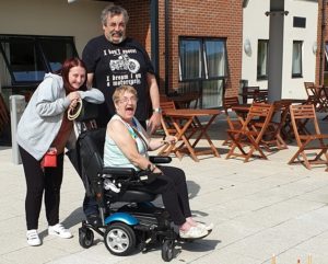 Jess Hoodlass, 24 with Mike Coombs, 60, and his partner Carol Mowforth at Redwood Glades Extra Care scheme in Hull.