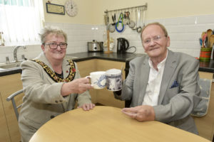 ) Lord Mayor of Leicester, Cllr Annette Byrne, with Clive Calow in his new kitchen.