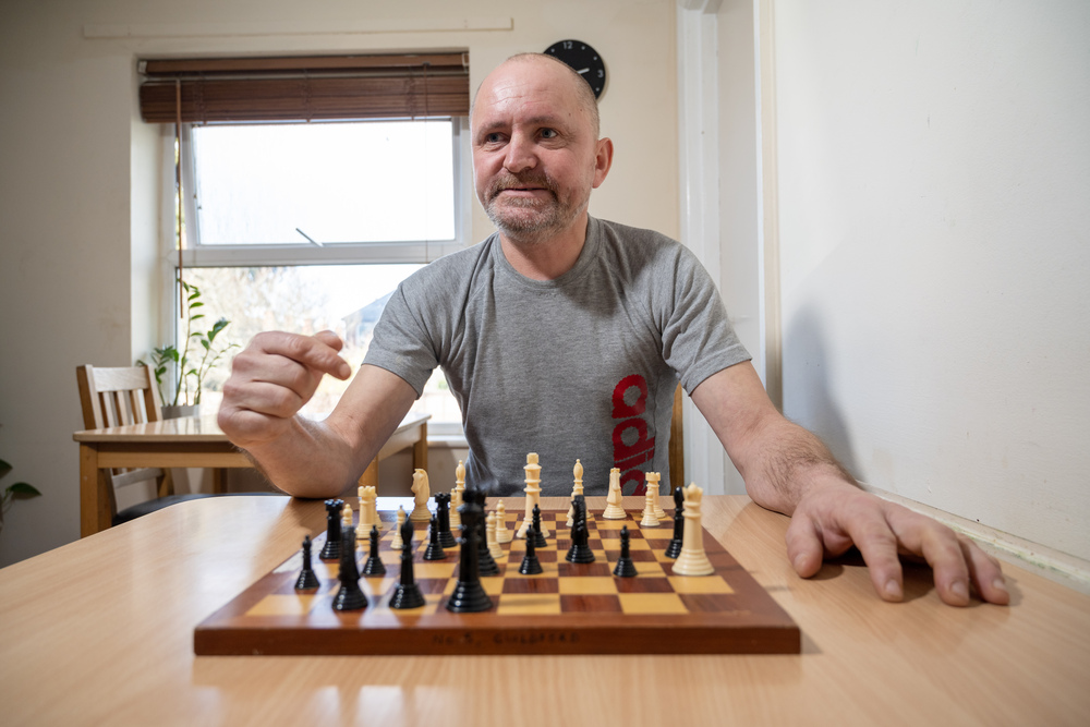 Customer at No.5 HUB in Guildford Surrey playing chess with staff member.