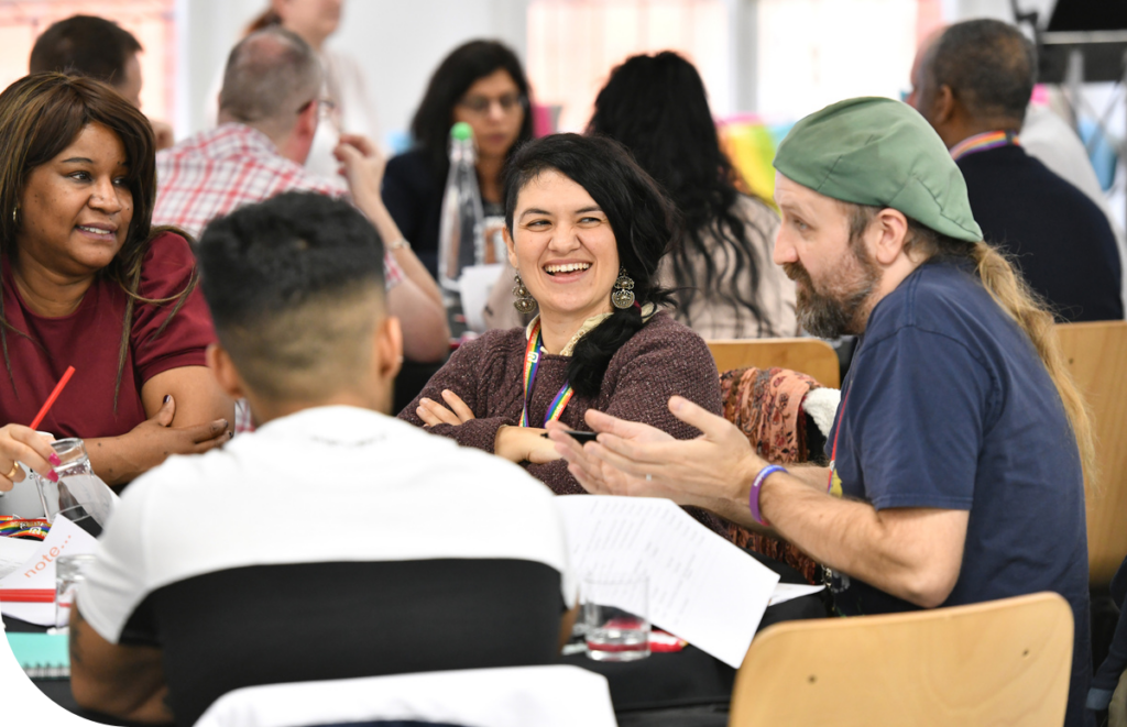Colleagues discussing a topic at a joint staff conference.