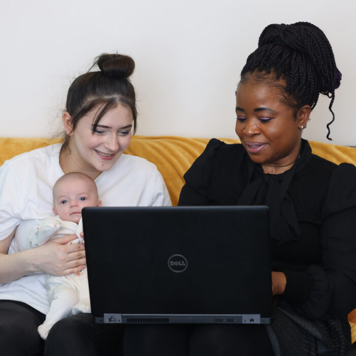 Customer with baby meeting with staff member at Young Family Service, Wakefield.
